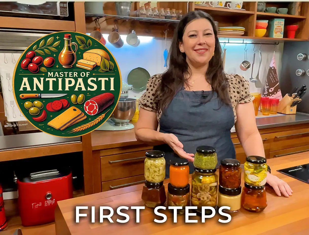 Grazie Canella presenting antipasti jars in the course kitchen.