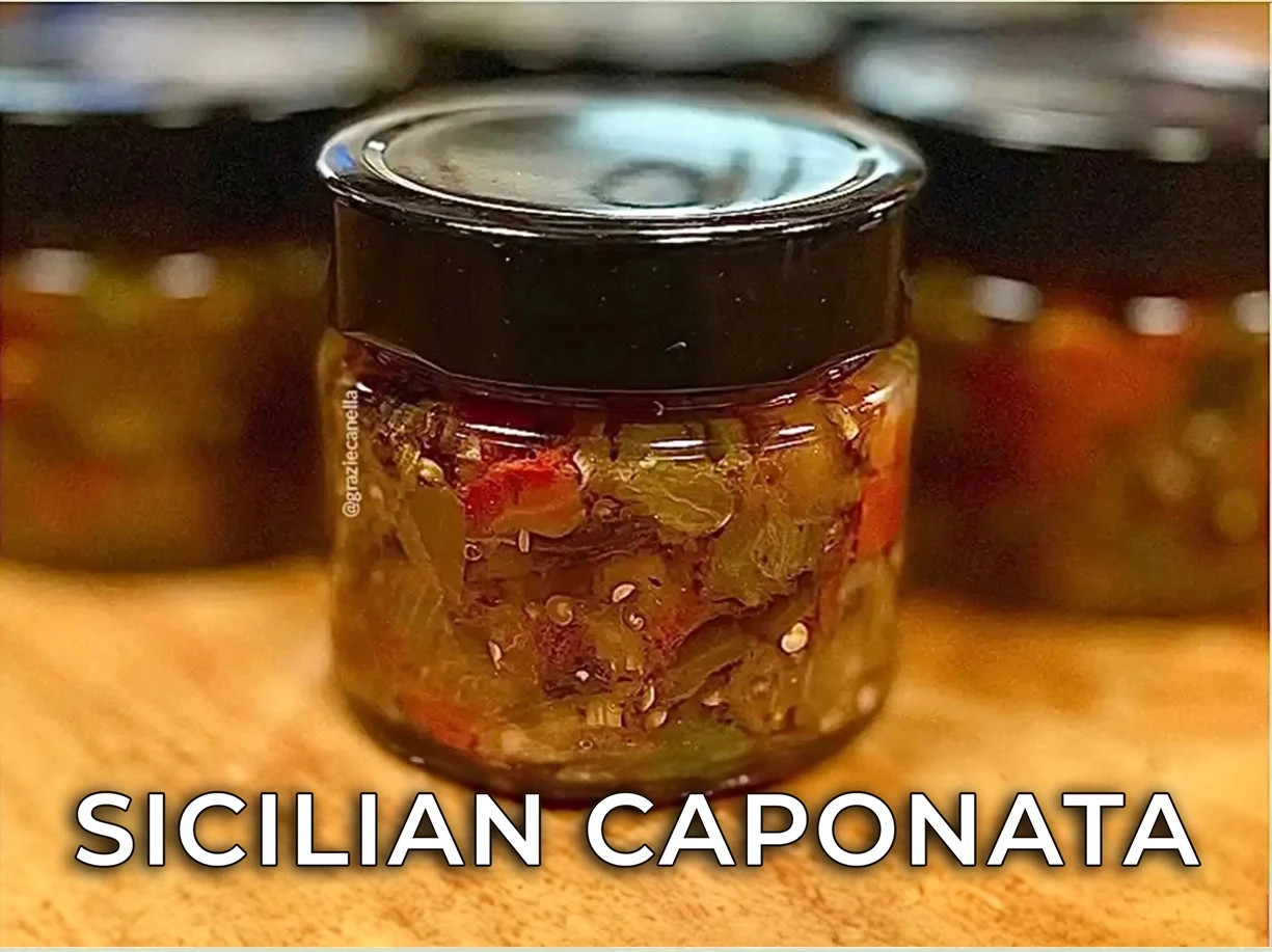 Jar of Sicilian caponata with eggplant, peppers and tomato